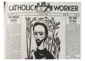 Framsidan av dagstidningen The Catholic Worker. I mitten bild av munk omgiven av palmer